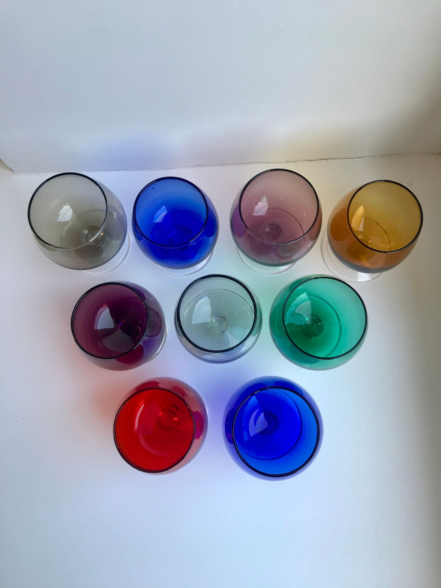 Set of 9 glasses with colored feet in blown glass 50s
