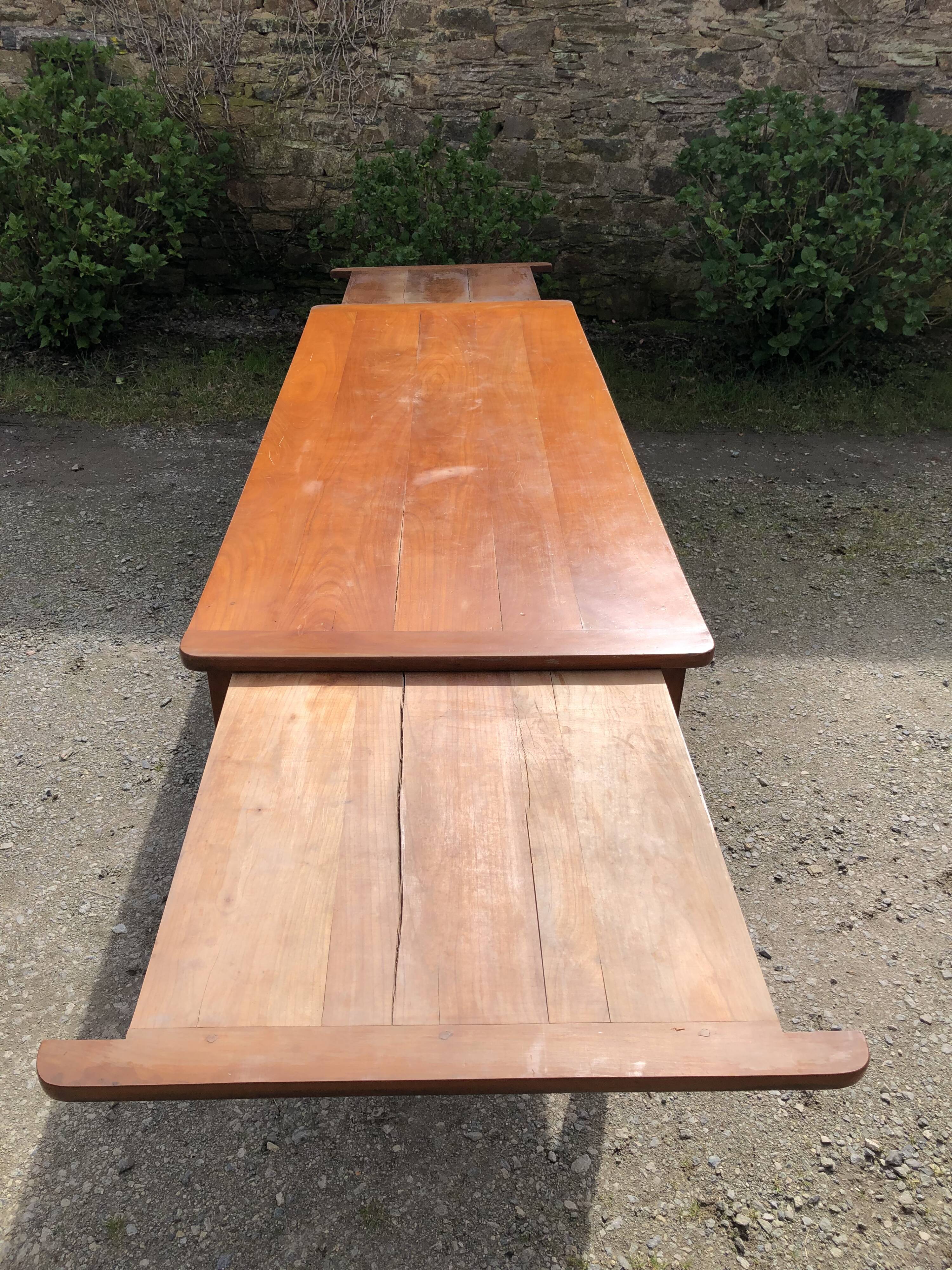 Antique Louis Philippe style farmhouse table in solid cherry wood with its 2 extensions.