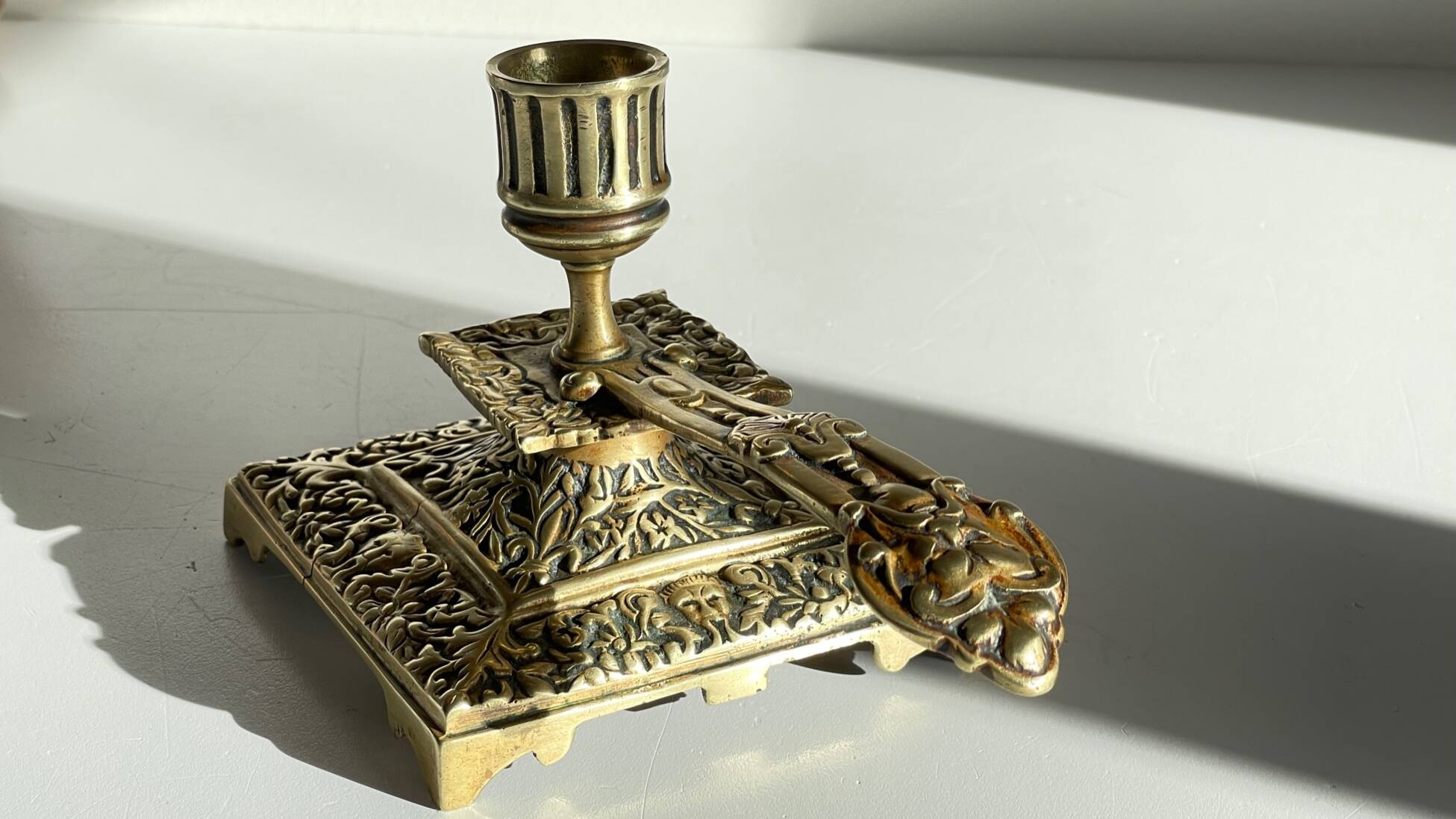 Patterned solid bronze hand candle holder