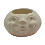 Cache pot visage
