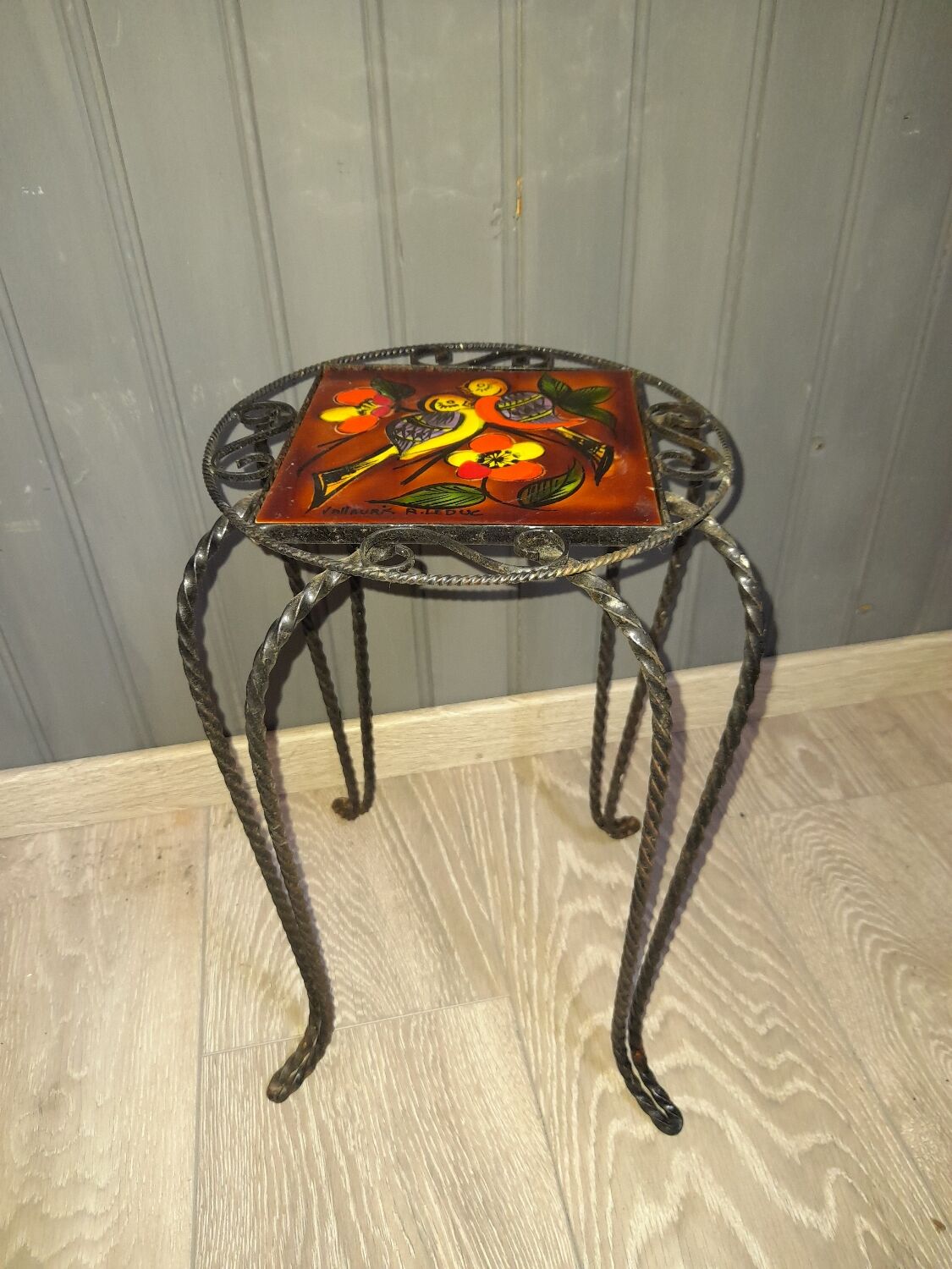 Wrought iron stool and Vallauris pottery signed Leduc.
