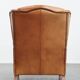 Fauteuil à oreilles en cuir de vache