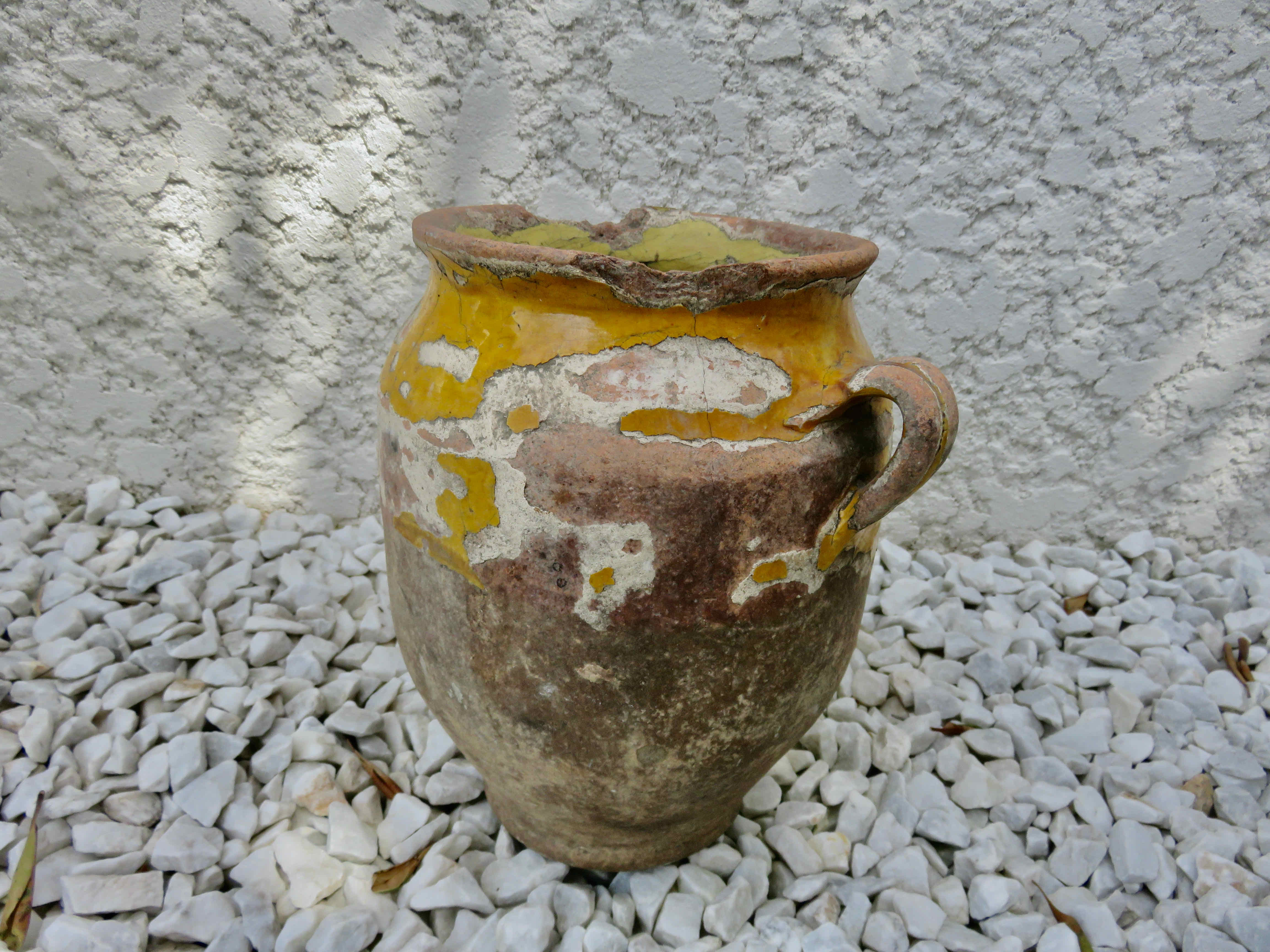 Old candied pot in yellow glazed terracotta XIX century