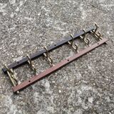 Coat rack, teak and brass coat hooks.
