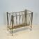 Neoclassical brass magazine rack attributed to Maison Ramsay.