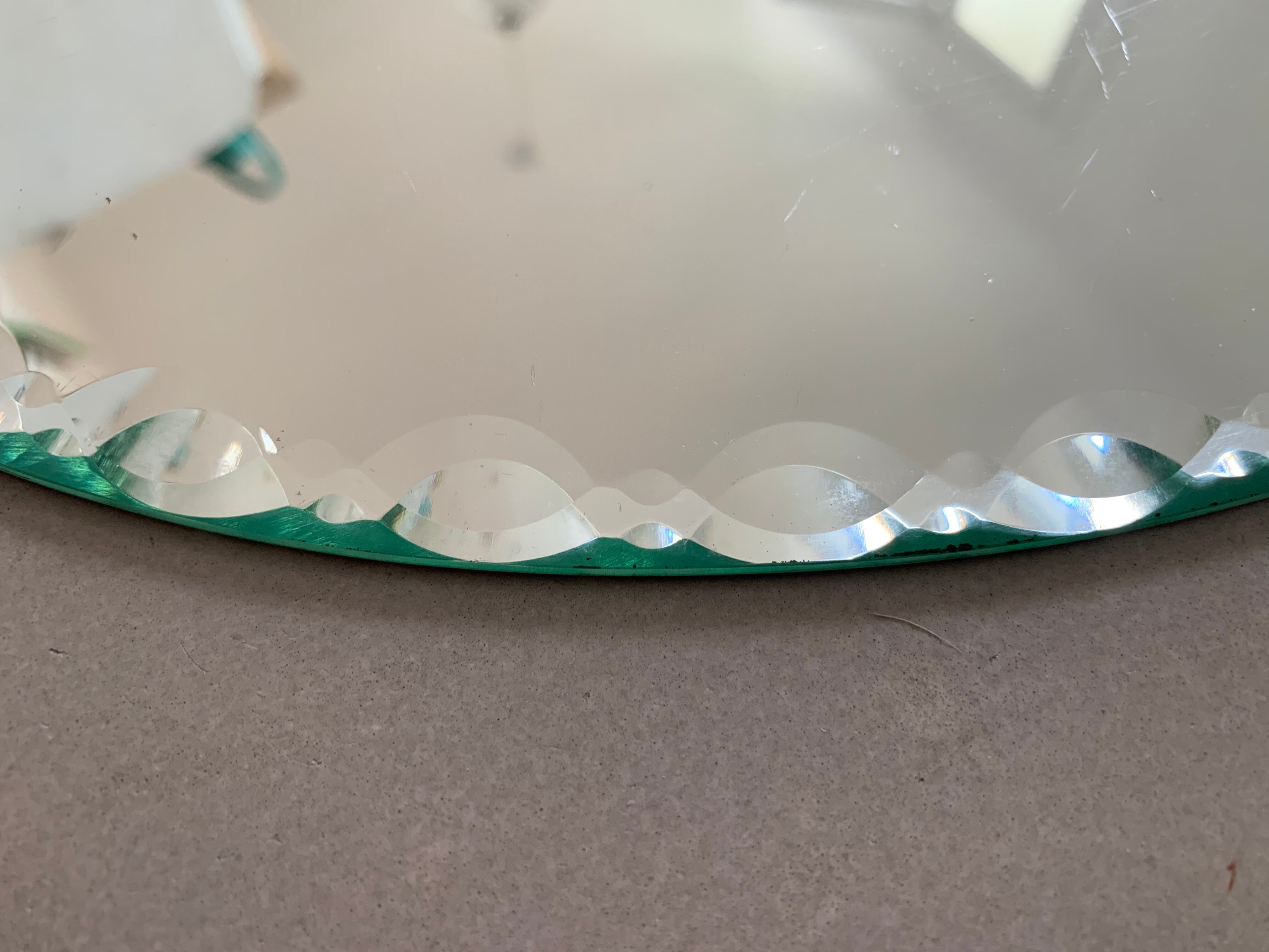 Old beveled oval mirror