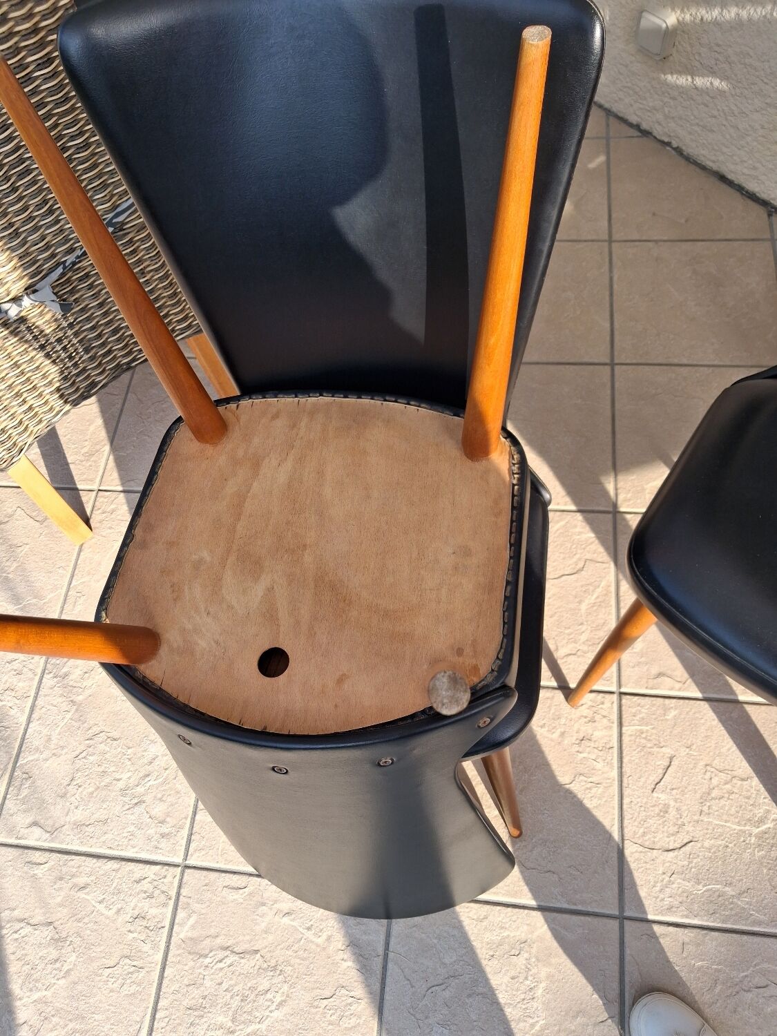 4 black Baumann style chairs