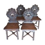 4 stylized dolphin back chairs