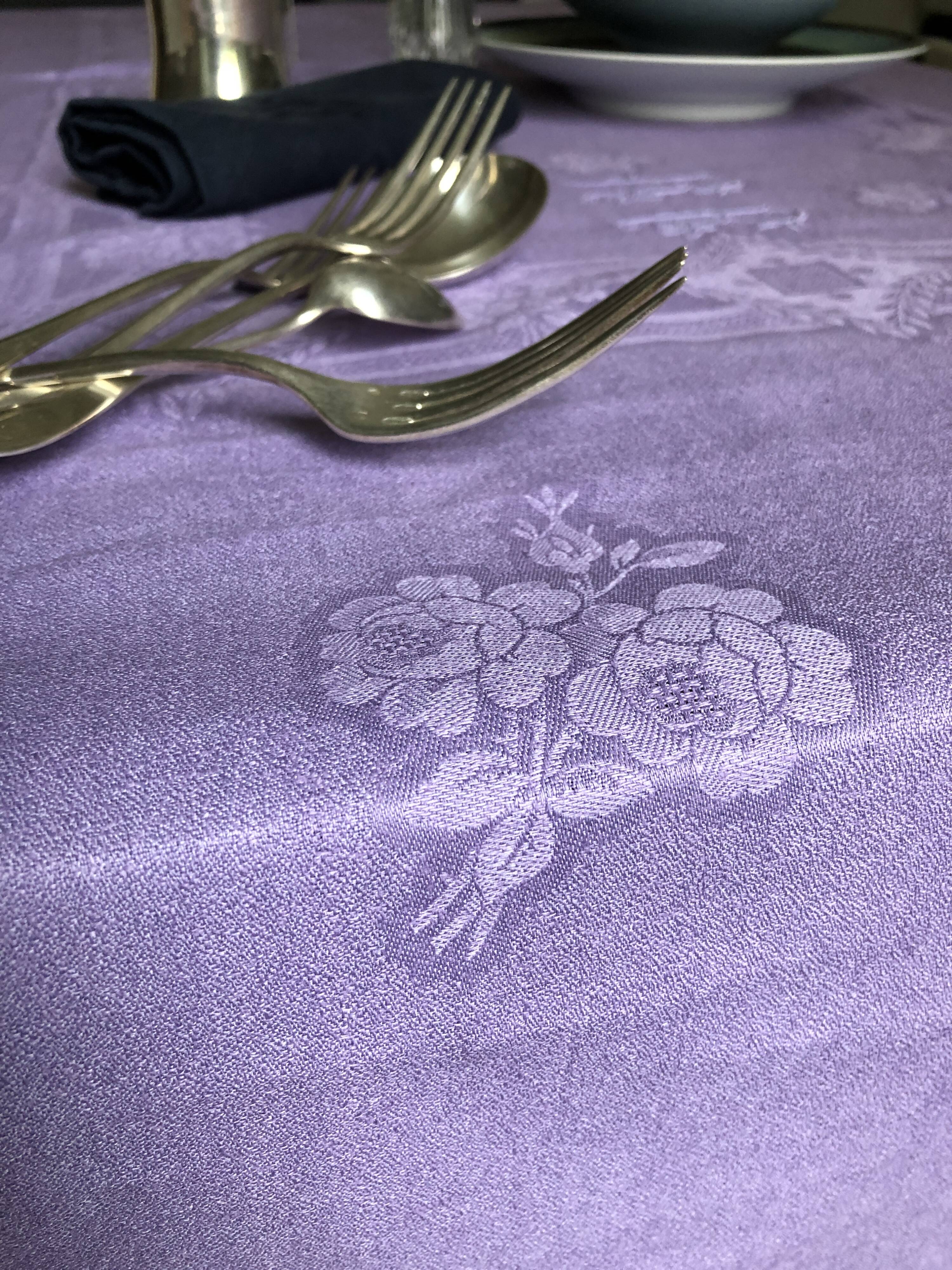 Old damask tablecloth in linen and purple silk
