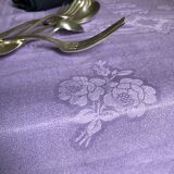 Old damask tablecloth in linen and purple silk
