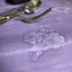 Old damask tablecloth in linen and purple silk