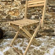 Antique folding chair with wooden slats