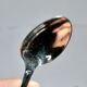 Ercuis set of 2 Trianon silver-plated dessert spoons with crossed ribbon, 15 cm