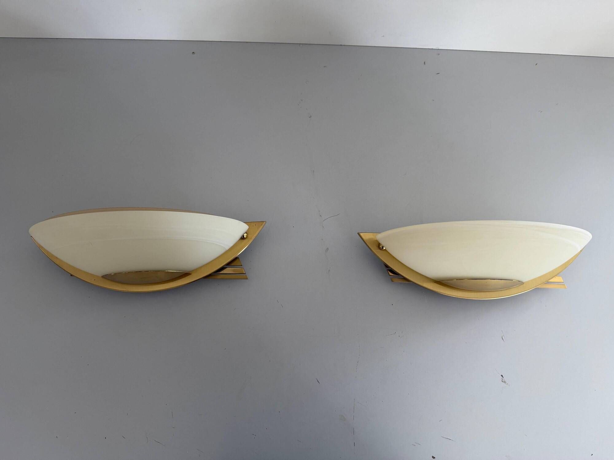 Pair of brass and glass wall lights from the Spage era, 1980, Germany.