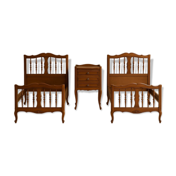 2 beds and a vintage bedside table in solid cherry wood