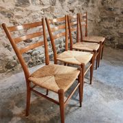 Set of 4 mid-century Italian dining chairs with woven seats, circa 1950–1970.