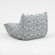 Togo lounge chair and pouf in patterned fabric by Michel Ducaroy for Ligne Roset, 1973, set of 2