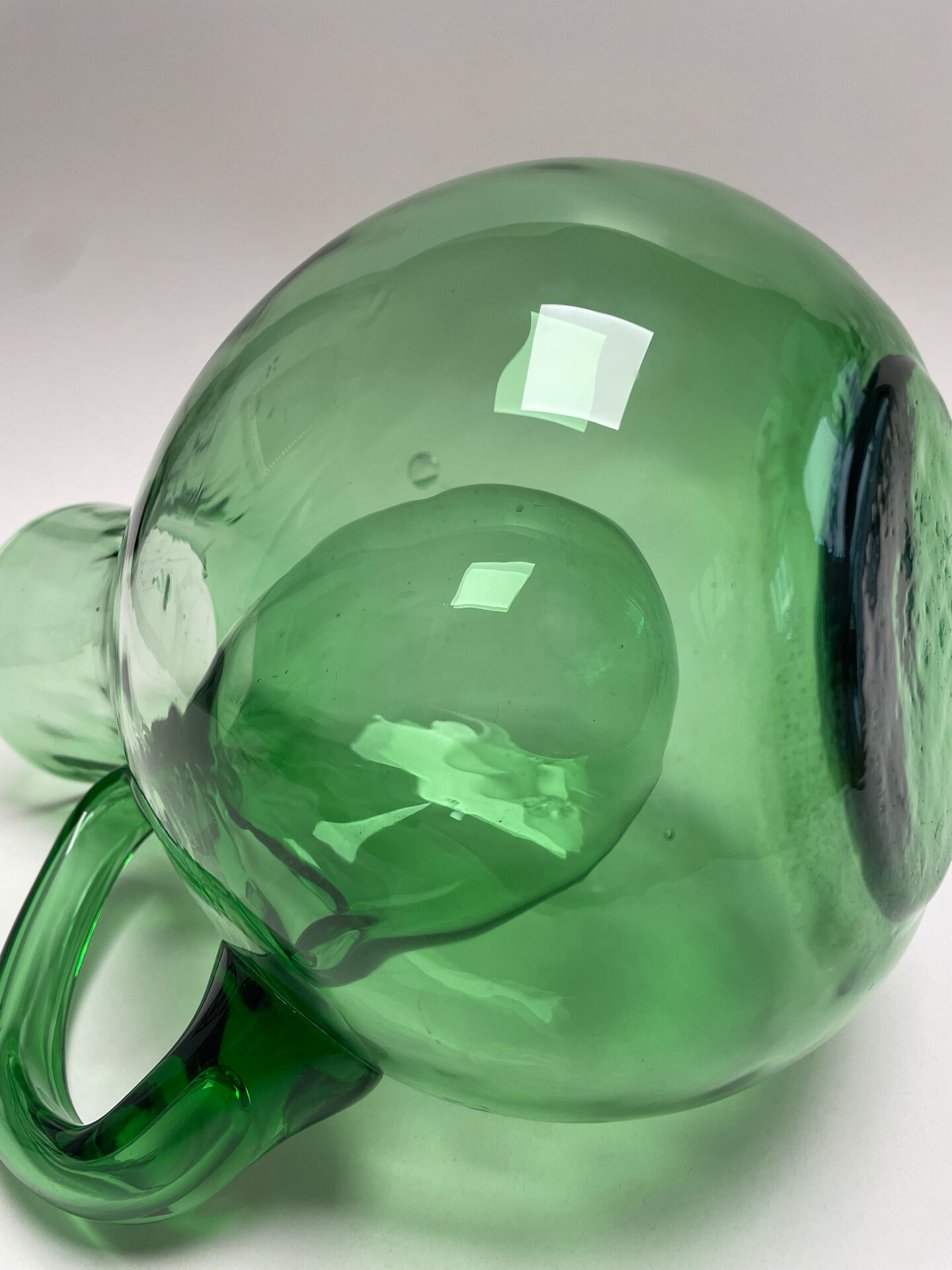 Large green glass cooling jug
