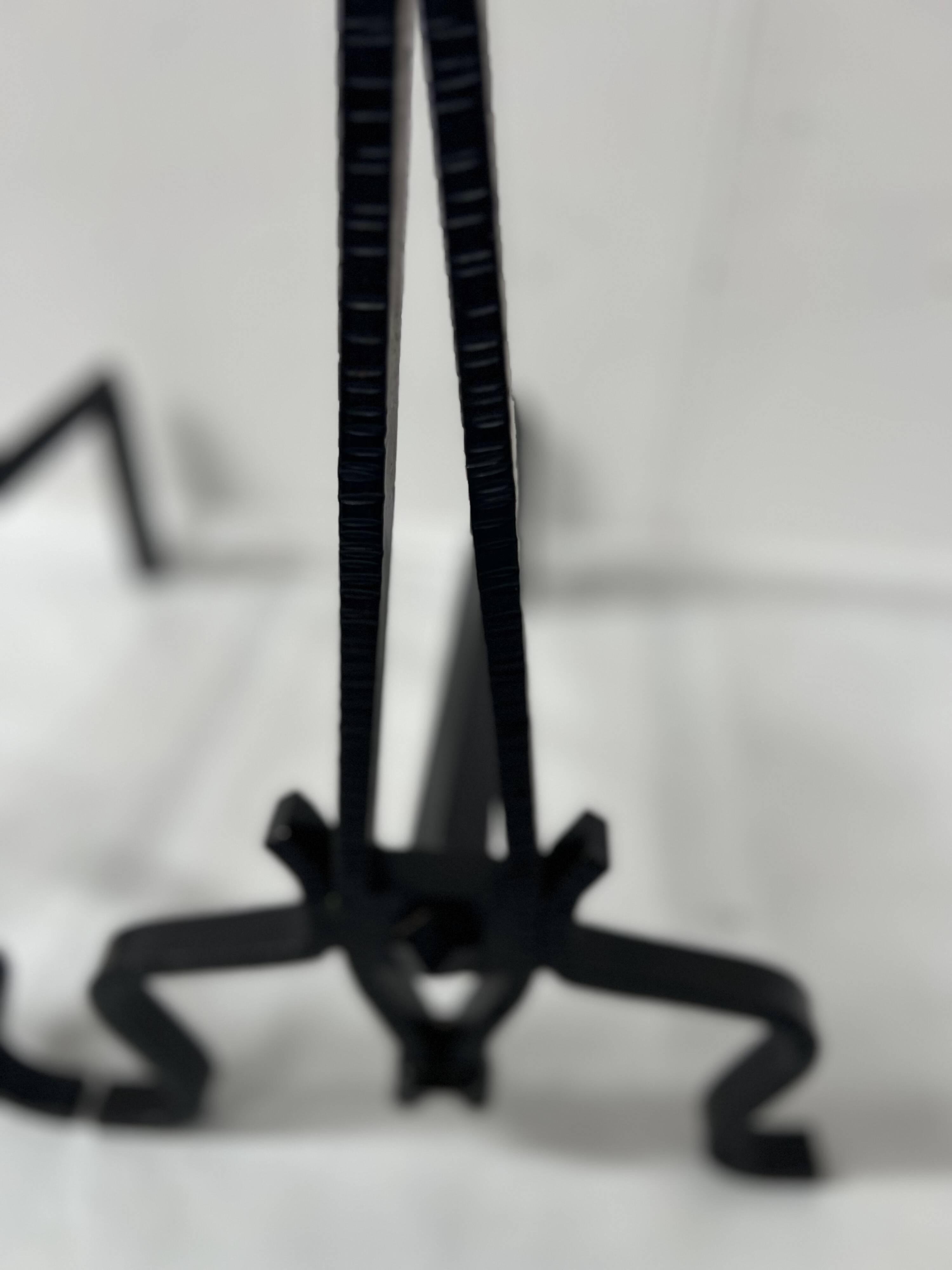 Pair of wrought and hammered iron bedside tables, 20th century