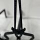 Pair of wrought and hammered iron bedside tables, 20th century