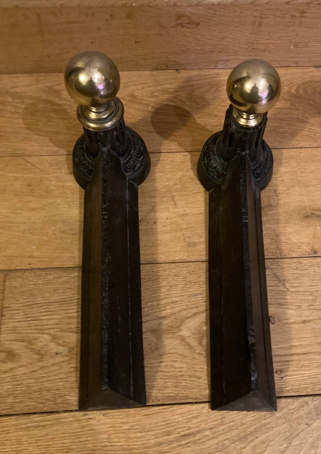 Pair of Napoleon III andirons from the 19th century in cast iron and brass