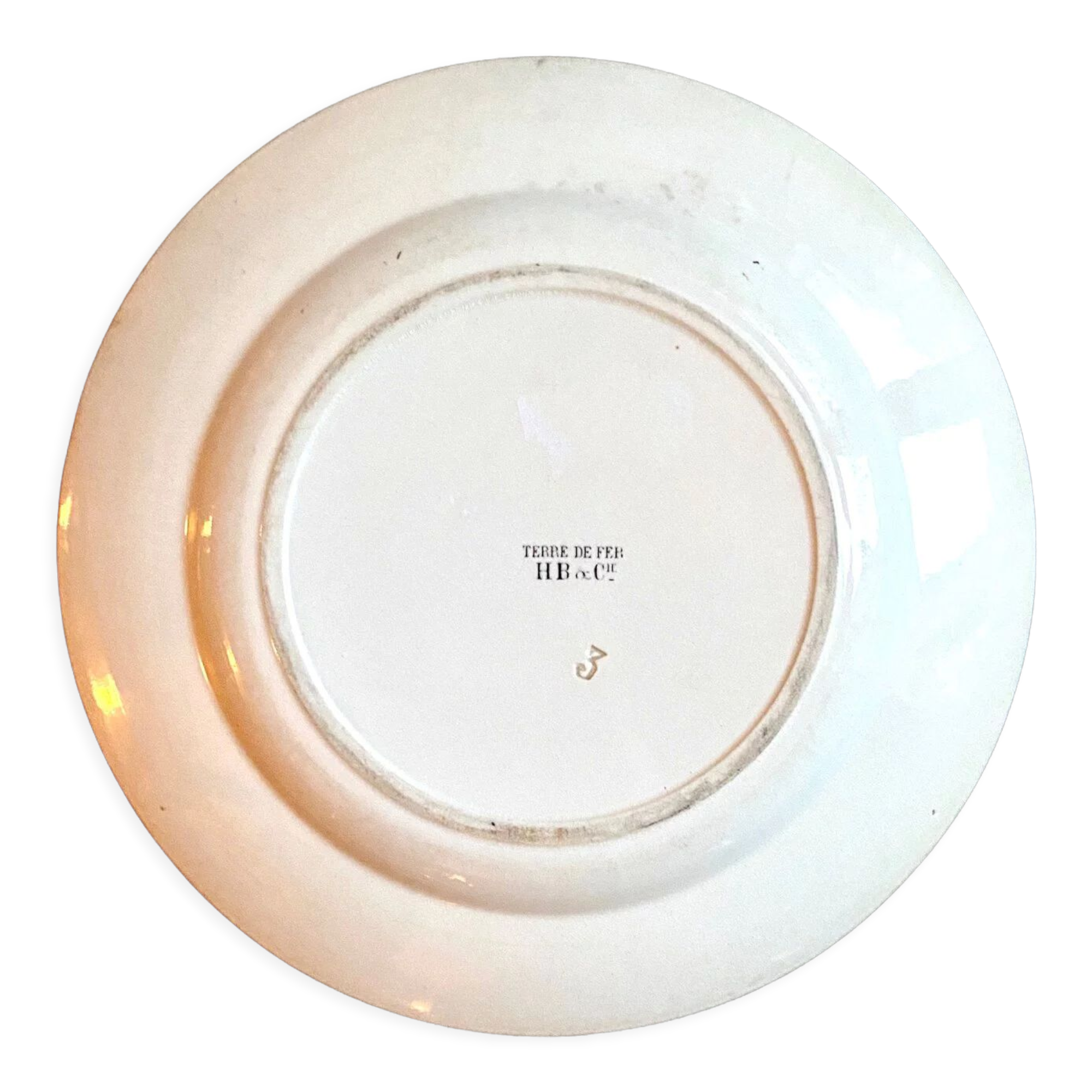 Round plate in iron earth HB & Cie