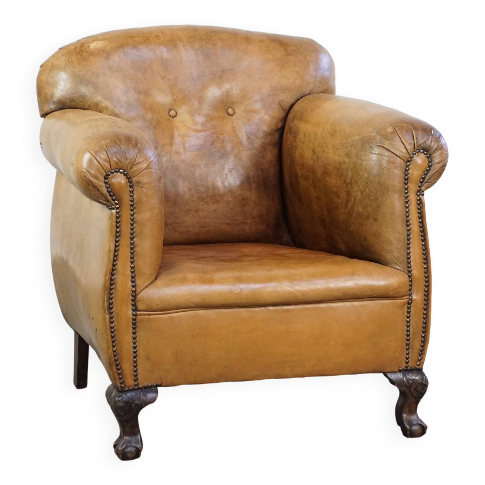 Fauteuil ancien en cuir de mouton