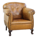 Fauteuil ancien en cuir de mouton