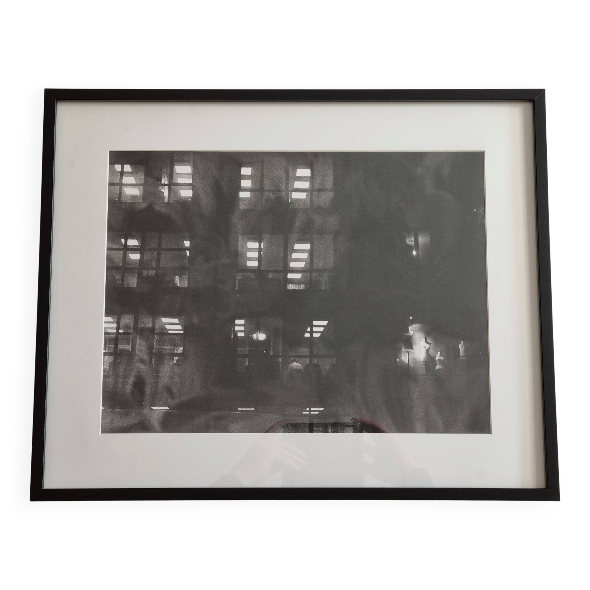 Framed black and white photograph of an urban scene by Rosine Nucimovici, 52x42 cm.