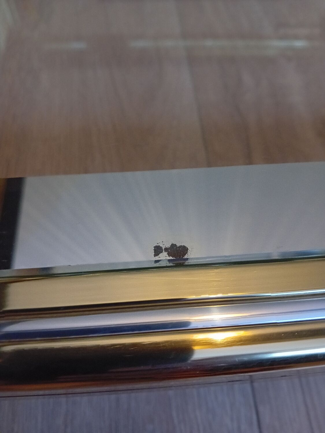 Glass and golden brass coffee table