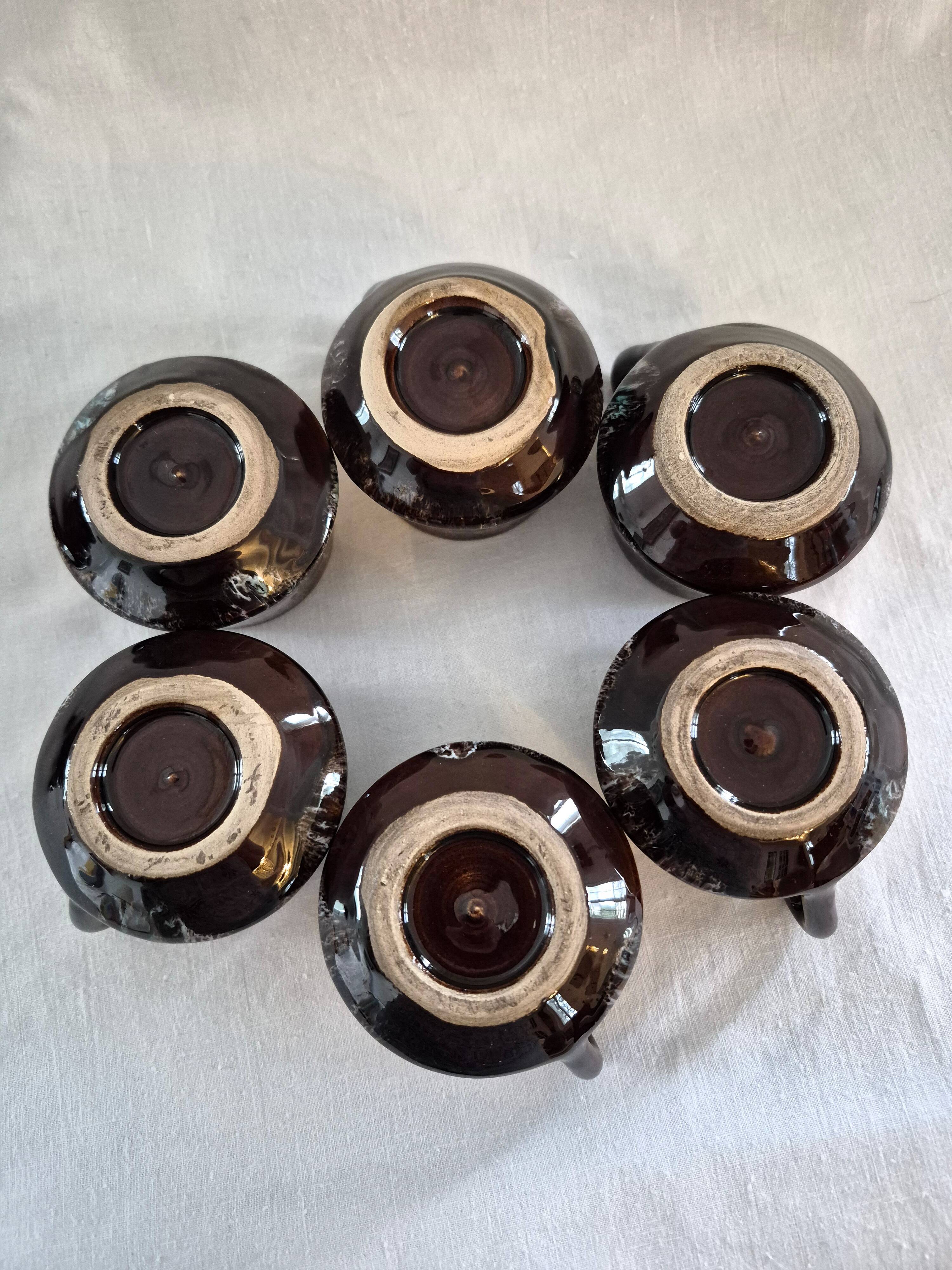 Six cups and saucers Vallauris glazed ceramic in brown and old pink.