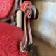 Napoleon III medallion armchair in carved wood and red velvet.
