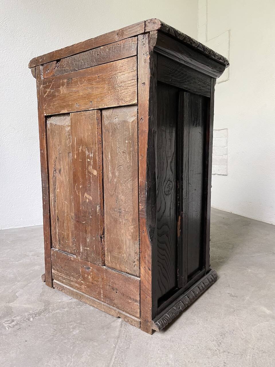 19th century chest of drawers in carved blackened pine