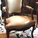 Louis XV period armchair in natural wood with convertible back carved with flowers