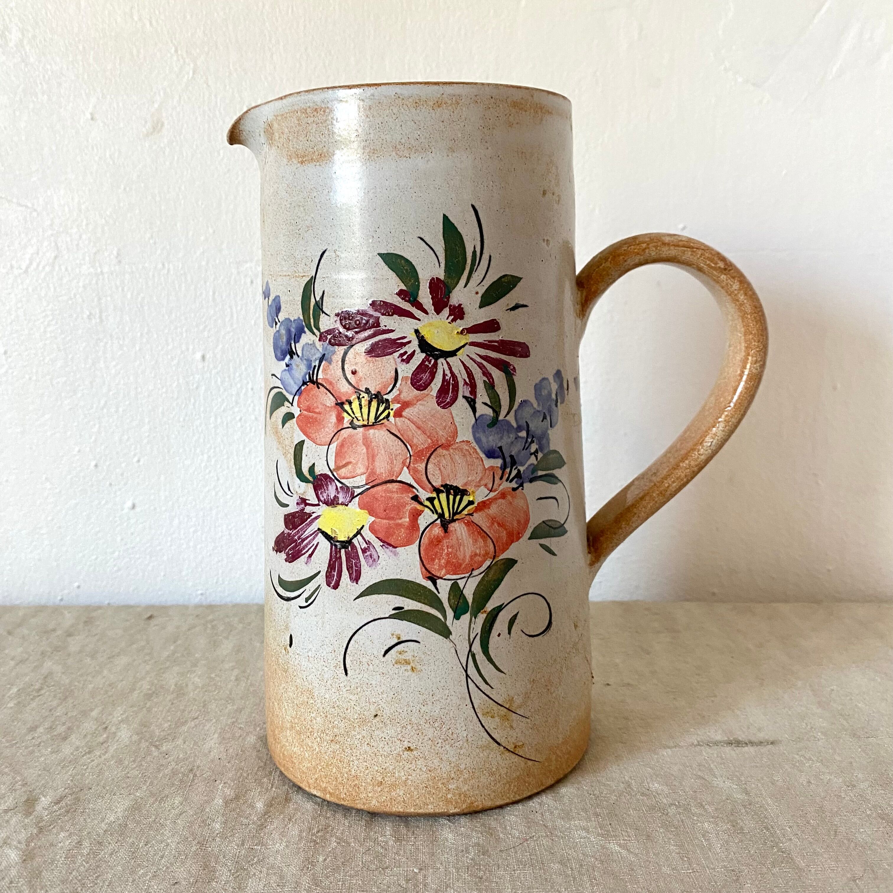 Stoneware pitcher with floral decoration