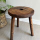 Three-legged wooden stool