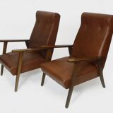 Pair of Scandinavian armchairs in brown leatherette and wood from the 50s and 60s