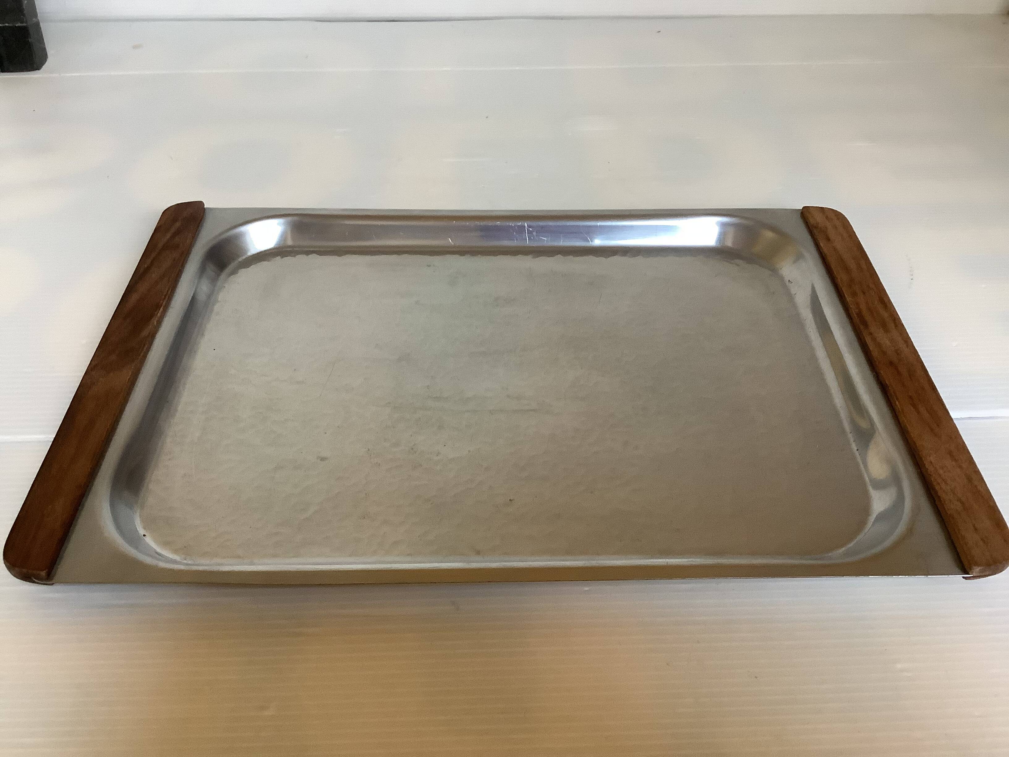 Small hammered metal and wood tray in Scandinavian style.