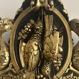 Napoleon III mirror with a pediment featuring black and gold dragons and birds.