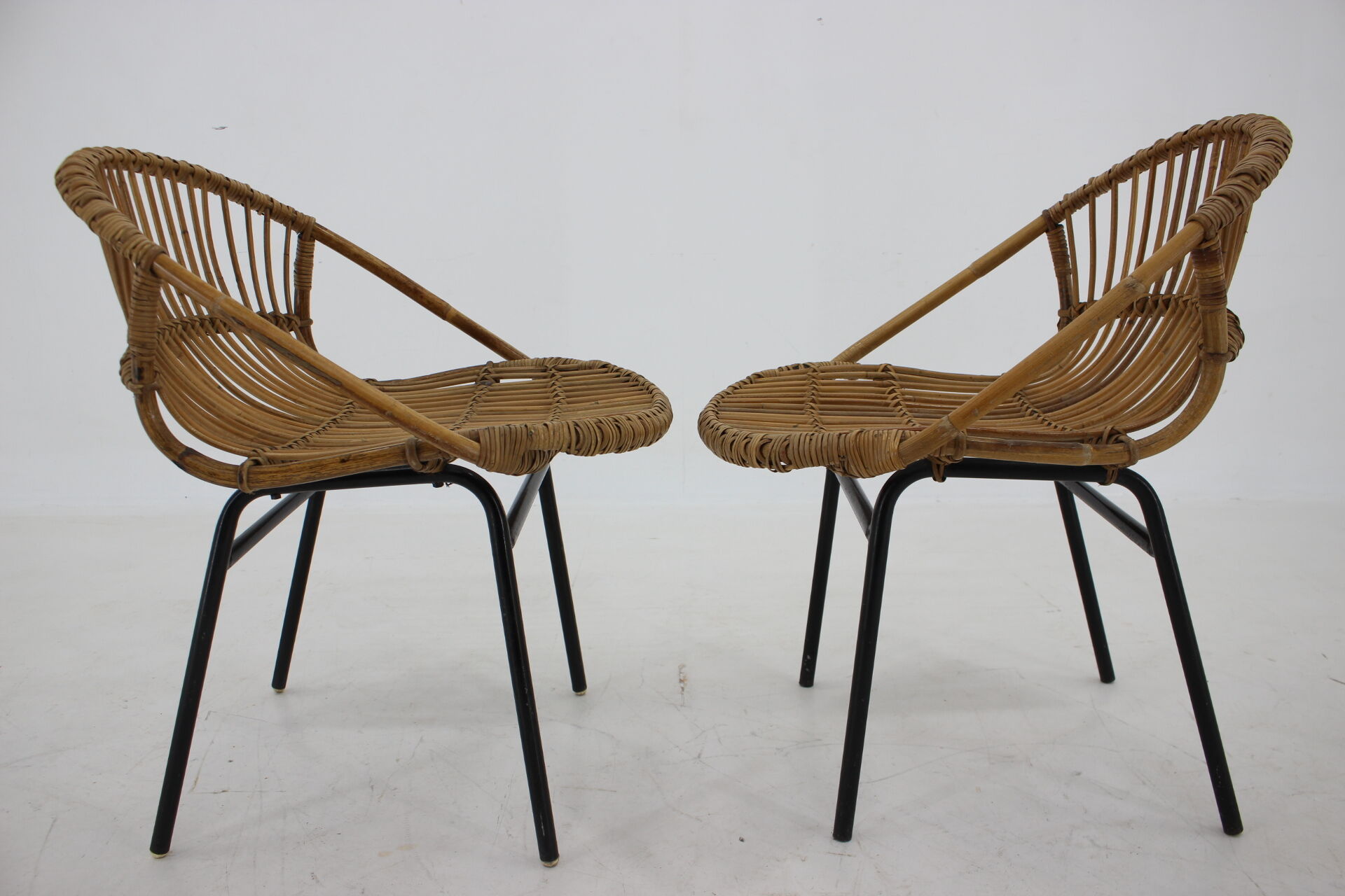 1970s pair of Alan Fuchs rattan and iron lounge chairs, Czechoslovakia