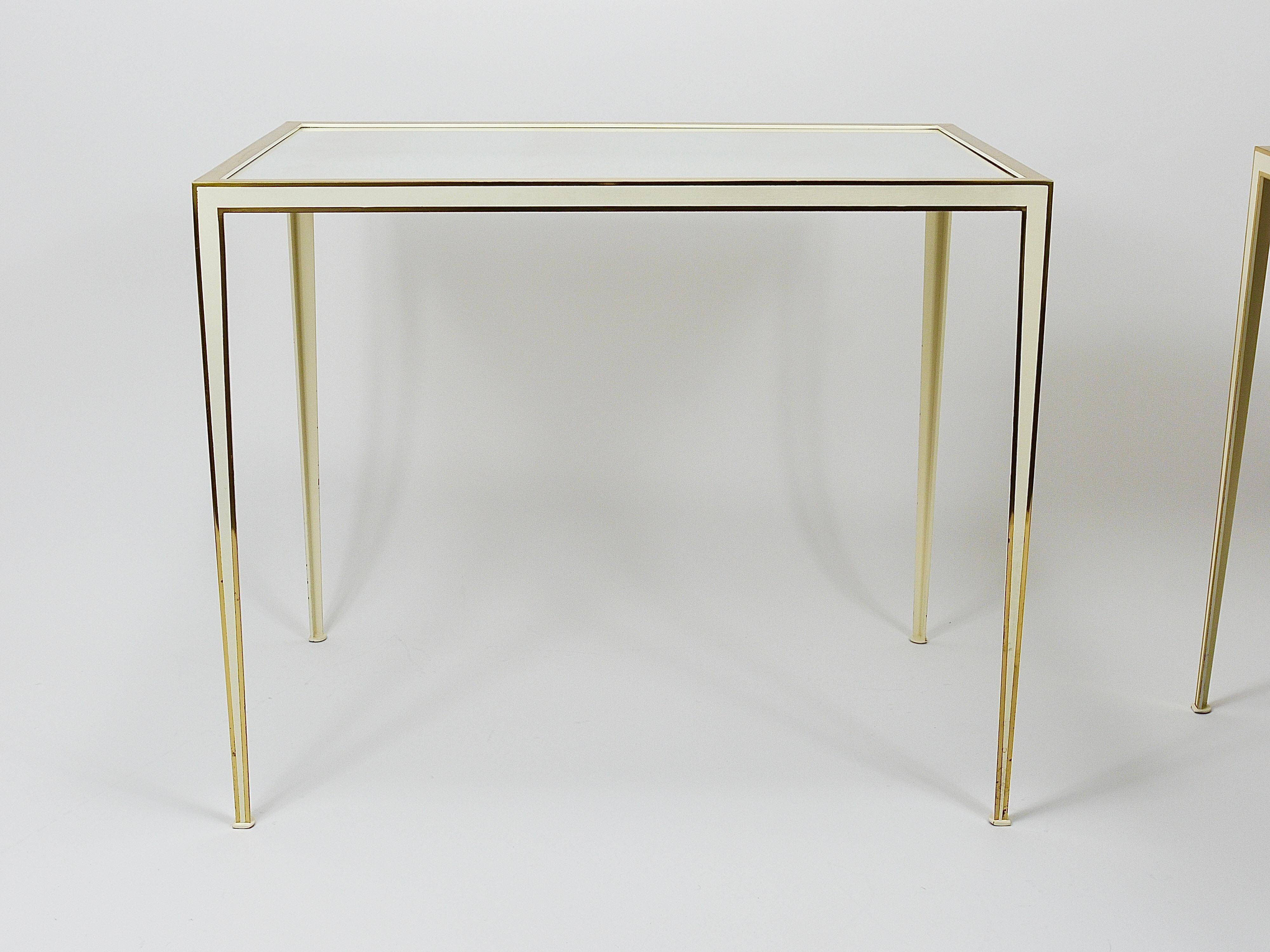 A pair of brass and white mirror tables from Vereinigte Werkstätten, Germany, 1970s.