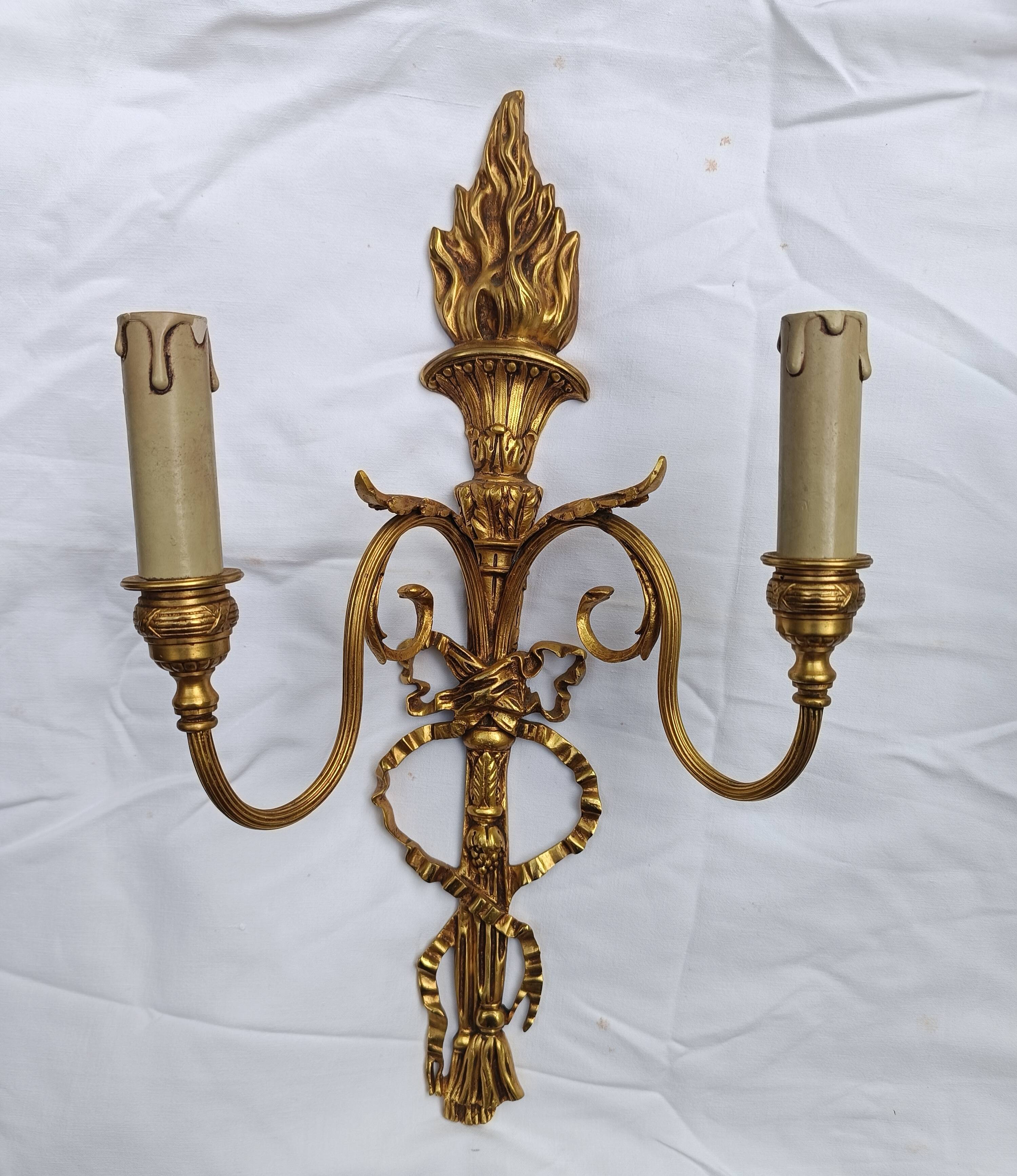 Pair of "torch" wall sconces Louis XVI in gilded bronze