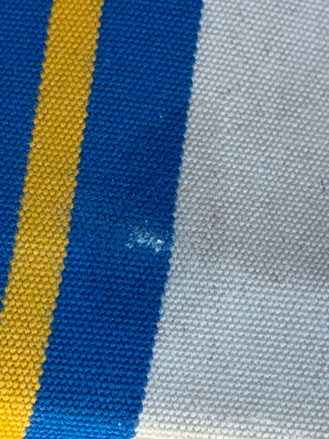 Vintage deck chair with blue and yellow striped fabric, original patina.