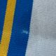 Vintage deck chair with blue and yellow striped fabric, original patina.