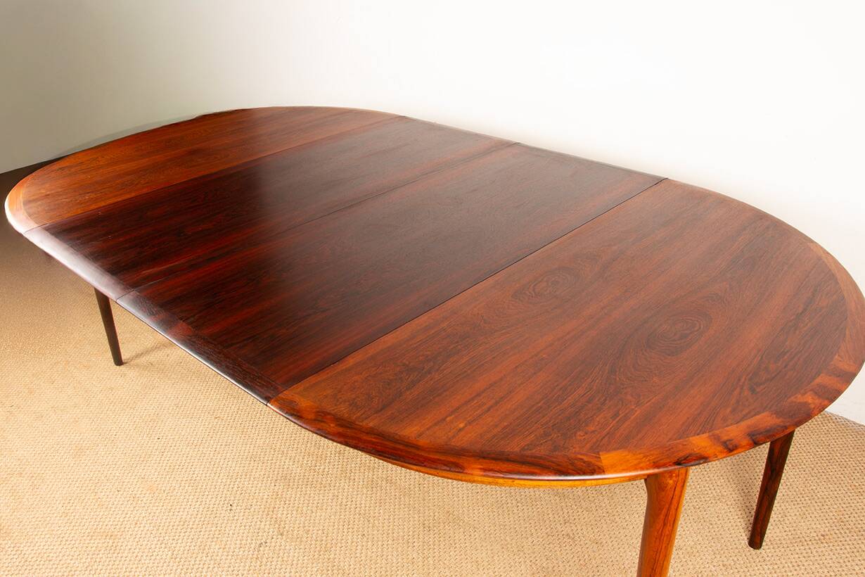Danish extendable dining table in rosewood by Kai Lyngfeldt Larsen.