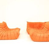 Togo sofa set and armchairs in pumpkin orange, 3 pieces, no label.