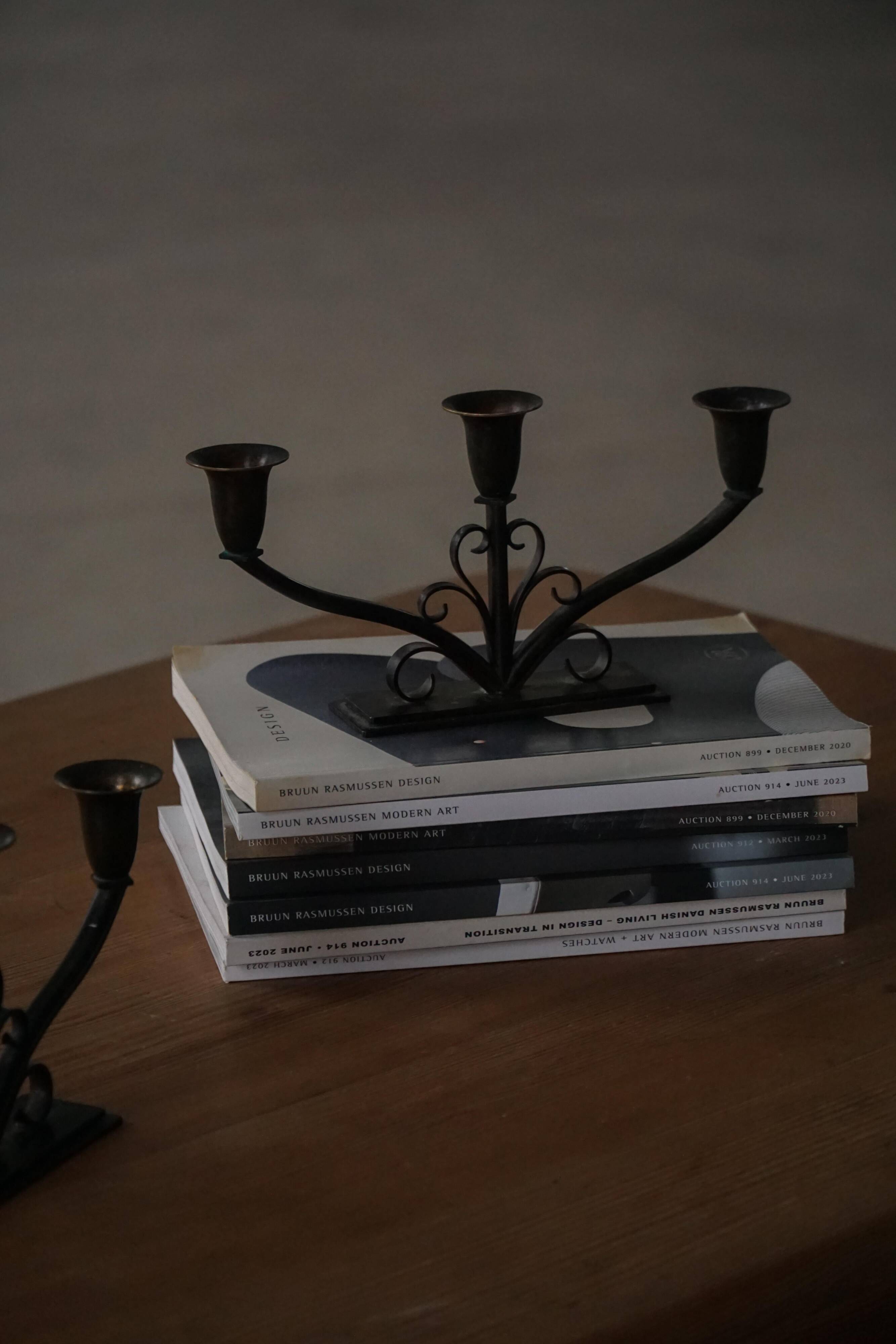 Early 20th century, pair of Danish Art Deco candlesticks in metal with three arms, 1930s.
