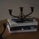 Early 20th century, pair of Danish Art Deco candlesticks in metal with three arms, 1930s.
