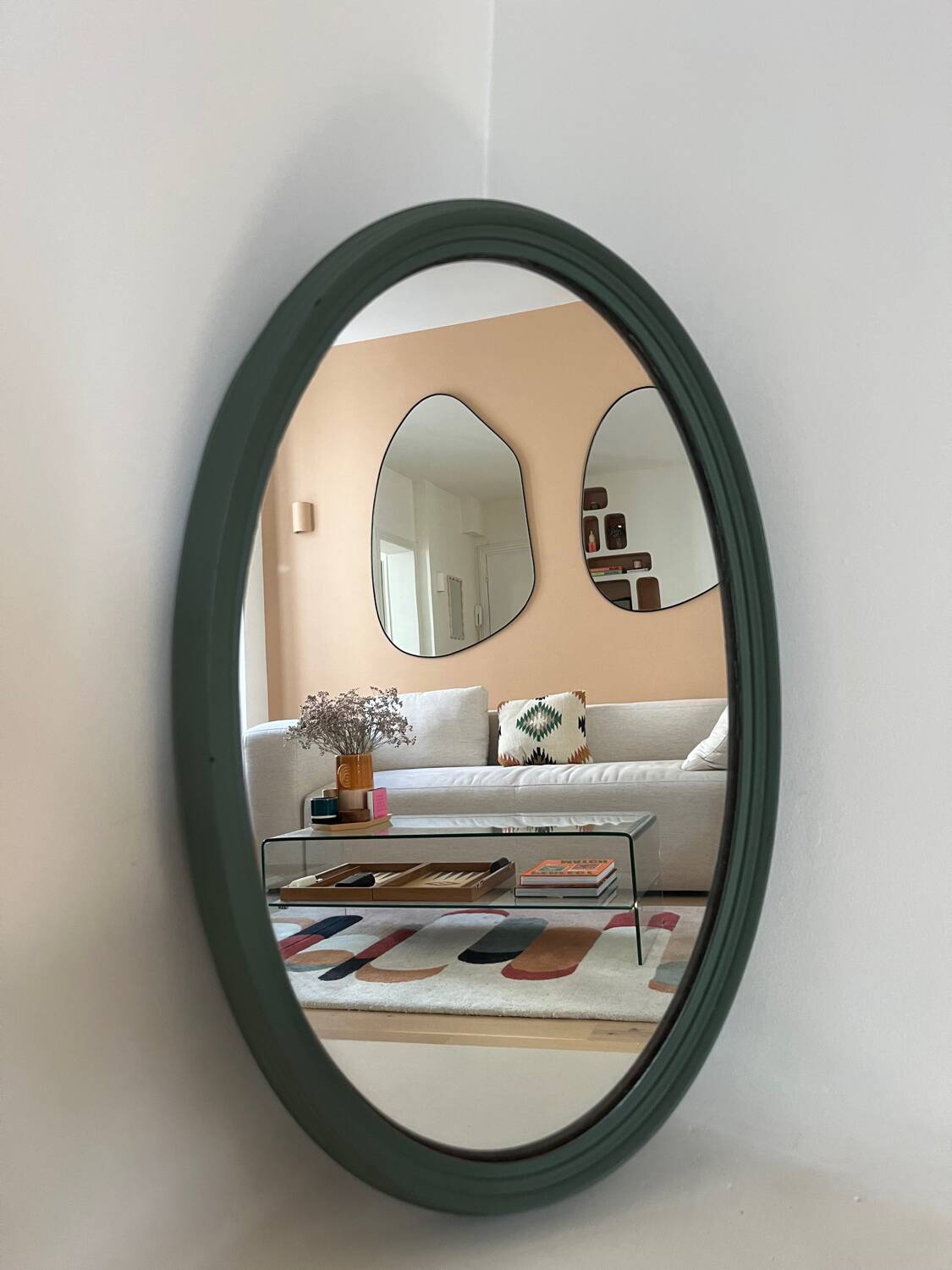 Green oval mirror