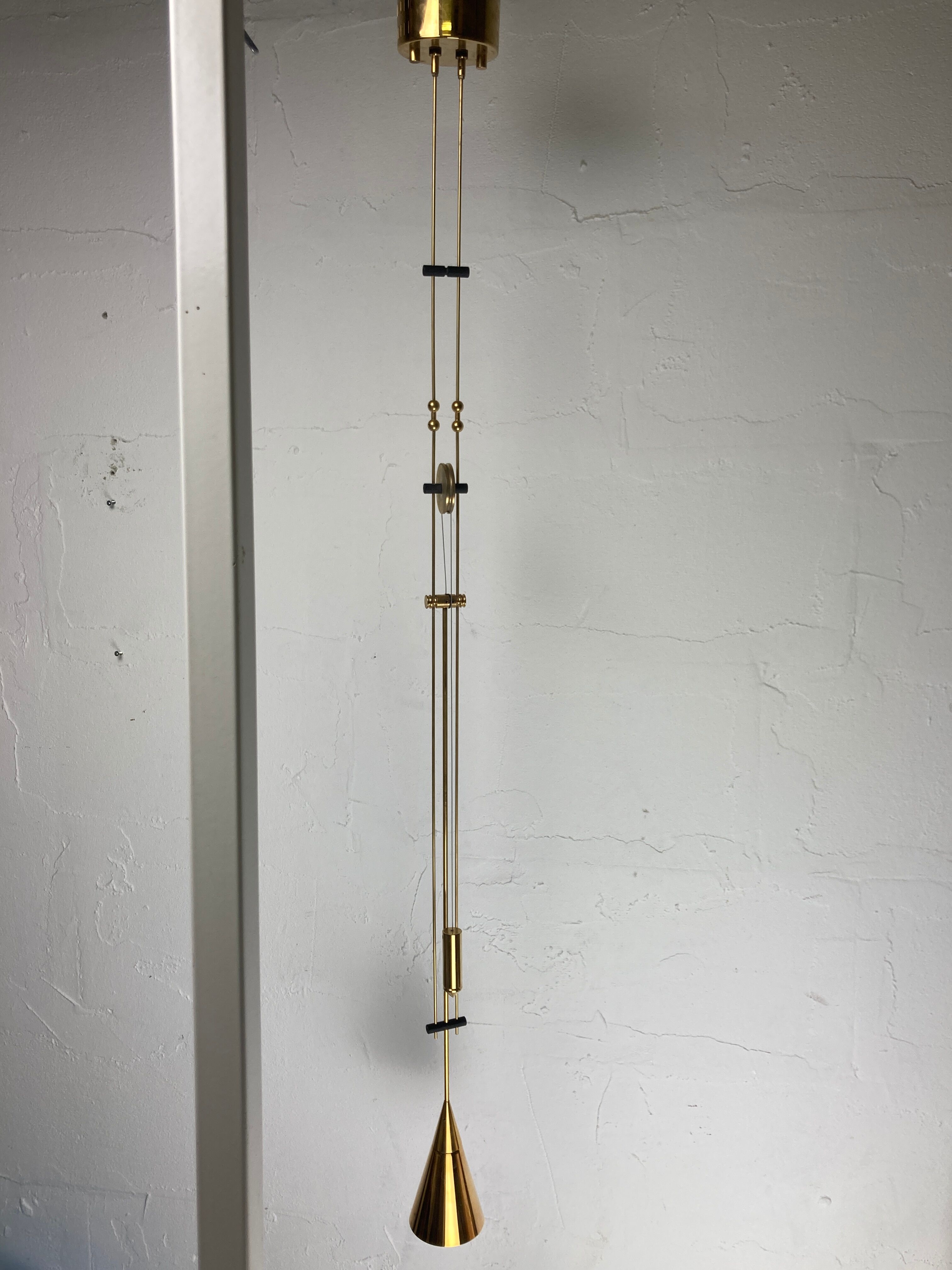 Patinated brass diabolo counterweight pendant lamp by SIsche, Germany